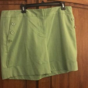 Green shorts with button accents
